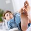 man-laying-down-barefoot