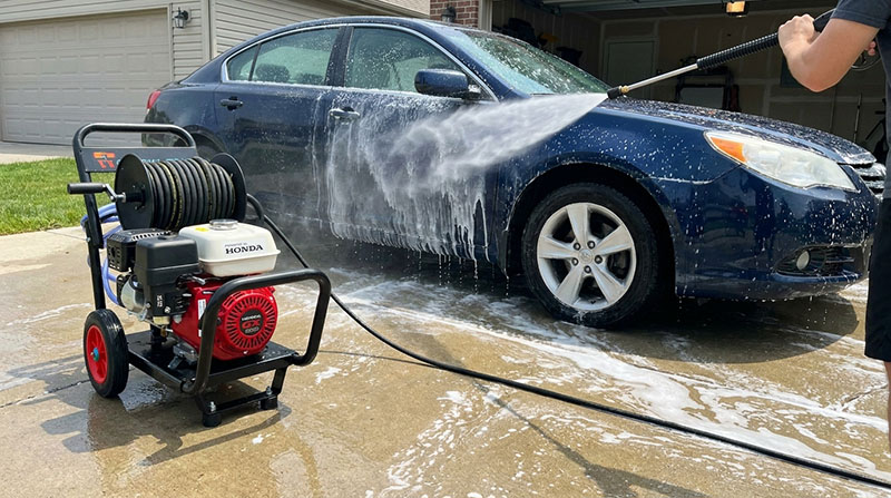 Man cleaning his car with a EMKO Pressure Washer